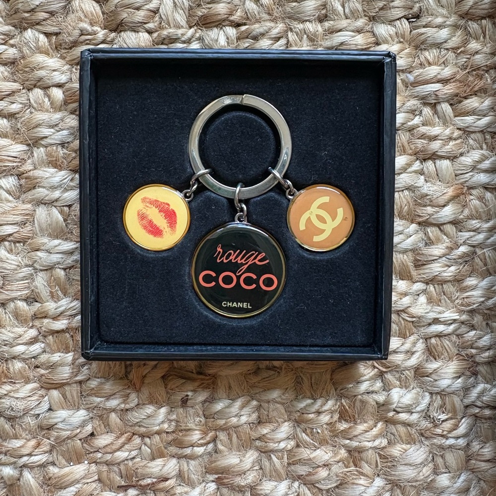 CHANEL Rouge Coco Keychain with Black and Gold Accents